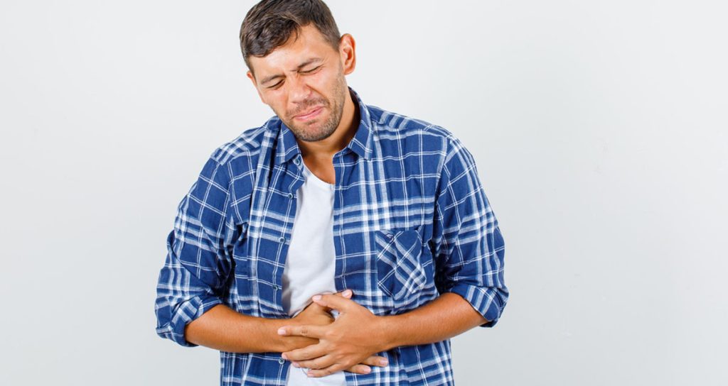 Man In Pain Due To Inflammatory Bowel Disease